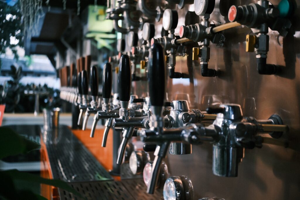 Row of beer taps at a bar
